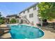 Home exterior showcasing backyard pool, patio, and access to upper-level balcony at 817 Highwater Pl, Fuquay Varina, NC 27526