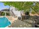 A backyard with pool, patio and deck, all nestled in a lush, private outdoor oasis at 817 Highwater Pl, Fuquay Varina, NC 27526