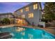 Stunning backyard featuring a sparkling pool, elevated deck, staircase, and a well-maintained two-story home at 817 Highwater Pl, Fuquay Varina, NC 27526