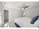 Comfortable bedroom with ceiling fan, carpet, and natural light makes for a relaxing retreat at 817 Highwater Pl, Fuquay Varina, NC 27526