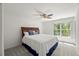 Cozy bedroom with a ceiling fan and a large window, creating a serene atmosphere at 817 Highwater Pl, Fuquay Varina, NC 27526