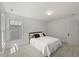 Bright bedroom with ample natural light and neutral tones provides a blank canvas for personalization at 817 Highwater Pl, Fuquay Varina, NC 27526