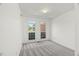 Bedroom featuring neutral carpet and plenty of natural light with a double window at 817 Highwater Pl, Fuquay Varina, NC 27526