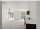 Bright bonus room with natural light and carpeted floors provides a versatile space at 817 Highwater Pl, Fuquay Varina, NC 27526
