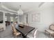 Formal dining room boasts neutral decor, chandelier lighting and an open floor plan at 817 Highwater Pl, Fuquay Varina, NC 27526