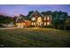 Classic brick home with a manicured lawn, inviting front facade and attached two-car garage at 817 Highwater Pl, Fuquay Varina, NC 27526