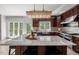 Gourmet kitchen featuring large island, stainless appliances, and ample cabinet space at 817 Highwater Pl, Fuquay Varina, NC 27526
