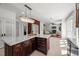 Gourmet kitchen flows into a living room with fireplace and features large island at 817 Highwater Pl, Fuquay Varina, NC 27526