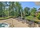 Outdoor patio with sun loungers and a fire pit, ideal for relaxation at 817 Highwater Pl, Fuquay Varina, NC 27526