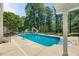 Private backyard pool, basketball hoop and slide for outdoor fun at 817 Highwater Pl, Fuquay Varina, NC 27526