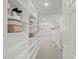 Bright walk-in closet with built-in shelving and carpeted floors offers ample storage at 817 Highwater Pl, Fuquay Varina, NC 27526