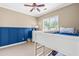 Bedroom featuring stylish blue wainscoting, neutral carpet, and a comfortable bunk bed at 8600 Clivedon Dr, Raleigh, NC 27615