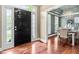 Inviting foyer with hardwood floors, decorative front door, and a glimpse into the formal dining room at 8600 Clivedon Dr, Raleigh, NC 27615