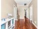 Spacious hallway with hardwood floors leads to various rooms in the home at 8600 Clivedon Dr, Raleigh, NC 27615