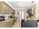 Spacious kitchen with granite countertops, stainless steel appliances, and a central island at 8600 Clivedon Dr, Raleigh, NC 27615
