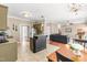 Open kitchen with granite countertops, tiled floors flows into the living room at 8600 Clivedon Dr, Raleigh, NC 27615