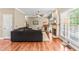 Inviting living room features a stone fireplace, ceiling fan, and wood floors at 8600 Clivedon Dr, Raleigh, NC 27615