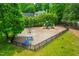 Community playground with slides, swings, and picnic benches surrounded by trees at 8600 Clivedon Dr, Raleigh, NC 27615