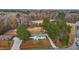 Expansive aerial view of a charming home on a large lot surrounded by mature trees and a long driveway at 900 Roxboro Road, Oxford, NC 27565