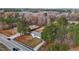Overhead angle of a well-maintained home on a lush, tree-lined lot, providing privacy and curb appeal at 900 Roxboro Road, Oxford, NC 27565