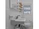 Bathroom with white tile walls, unique shelving and modern fixtures at 900 Roxboro Road, Oxford, NC 27565