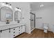 Bathroom featuring double vanity, modern fixtures, and glass shower at 900 Roxboro Road, Oxford, NC 27565