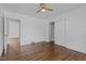 Bedroom featuring hardwood floors, closet, and a ceiling fan at 900 Roxboro Road, Oxford, NC 27565