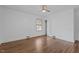 Spacious bedroom with hardwood floors, large window, closet, and a ceiling fan at 900 Roxboro Road, Oxford, NC 27565