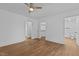 Spacious bedroom with a ceiling fan, two closets, and wood-look flooring at 900 Roxboro Road, Oxford, NC 27565