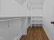 Walk-in closet with ample shelving and wood-look floors at 900 Roxboro Road, Oxford, NC 27565