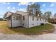 A home with white siding and black trim with an awning at 900 Roxboro Road, Oxford, NC 27565