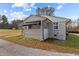 A home with white siding and black trim and an awning at 900 Roxboro Road, Oxford, NC 27565
