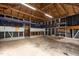 Spacious garage interior with exposed wooden beams and ample room for parking and storage at 900 Roxboro Road, Oxford, NC 27565