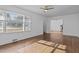 Inviting living area with gleaming hardwood floors, a ceiling fan, and well-lit open layout at 900 Roxboro Road, Oxford, NC 27565