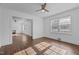 Open living space with natural light, hardwood floors, and a seamless transition to other living areas at 900 Roxboro Road, Oxford, NC 27565