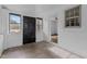 A quaint, bright porch features whitewashed brick, tile flooring, and natural light streaming through multiple windows at 900 Roxboro Road, Oxford, NC 27565