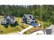 A luxurious home in a serene neighborhood, featuring a long driveway and well-maintained lawns at 904 Harrison Ridge Rd, Wake Forest, NC 27587