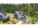 Stunning aerial view of the house showcases manicured lawns, landscaping, and a modern elevation at 904 Harrison Ridge Rd, Wake Forest, NC 27587