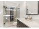 Bathroom featuring shower with glass door, and vanity with elegant fixtures at 904 Harrison Ridge Rd, Wake Forest, NC 27587