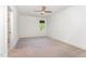 Neutral carpeted bedroom with ceiling fan and doorway to the rest of the home at 904 Harrison Ridge Rd, Wake Forest, NC 27587