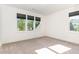 Bright bedroom with three windows and neutral carpet at 904 Harrison Ridge Rd, Wake Forest, NC 27587