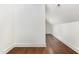 Hallway view features wood floors, white trim, and a slanted ceiling with recessed lighting at 904 Harrison Ridge Rd, Wake Forest, NC 27587