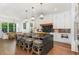 Bright, open kitchen featuring large island with bar seating and a dining area at 904 Harrison Ridge Rd, Wake Forest, NC 27587