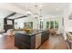 Bright, open kitchen featuring a large center island, stainless steel appliances and hardwood floors at 904 Harrison Ridge Rd, Wake Forest, NC 27587