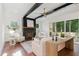Cozy living room featuring a fireplace, ceiling fan, and sliding doors opening to the outside at 904 Harrison Ridge Rd, Wake Forest, NC 27587