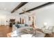 Spacious living room showcasing beamed ceilings, an open floor plan, and natural light at 904 Harrison Ridge Rd, Wake Forest, NC 27587