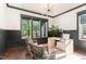 Stylish home office with large windows, hardwood floors, and modern decor at 904 Harrison Ridge Rd, Wake Forest, NC 27587