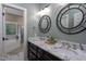 Bathroom with double sinks, marble countertops, and tiled shower and bath at 945 Jones Wynd, Wake Forest, NC 27587