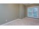 A bedroom featuring neutral carpet and a window at 945 Jones Wynd, Wake Forest, NC 27587