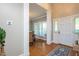 Welcoming entryway with hardwood floors, white columns, and natural light at 945 Jones Wynd, Wake Forest, NC 27587